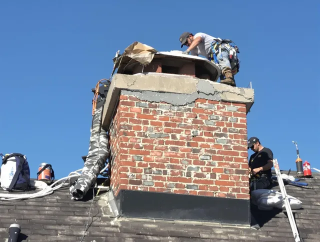Rosemead Chimney Sweep installing a custom chimney crown in Rosemead, CA