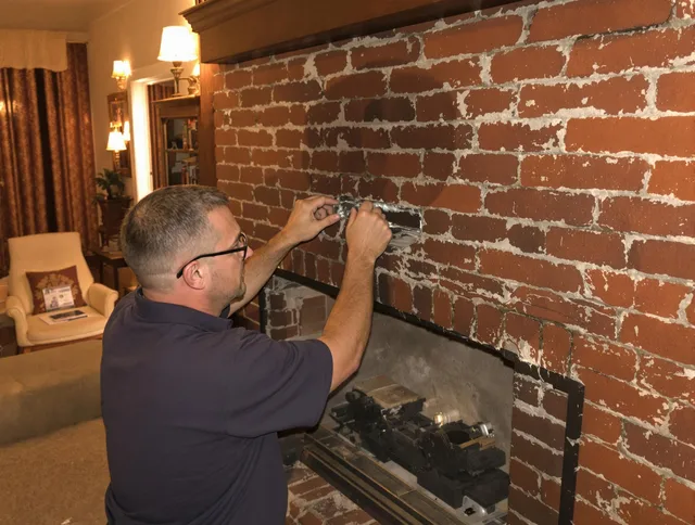 Rosemead Chimney Sweep expert fixing a fireplace in Rosemead, CA